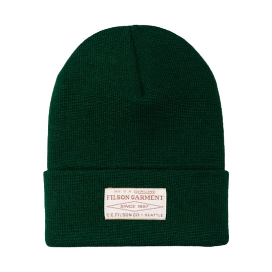 Dark green knit beanie with a folded cuff and front Filson label patch