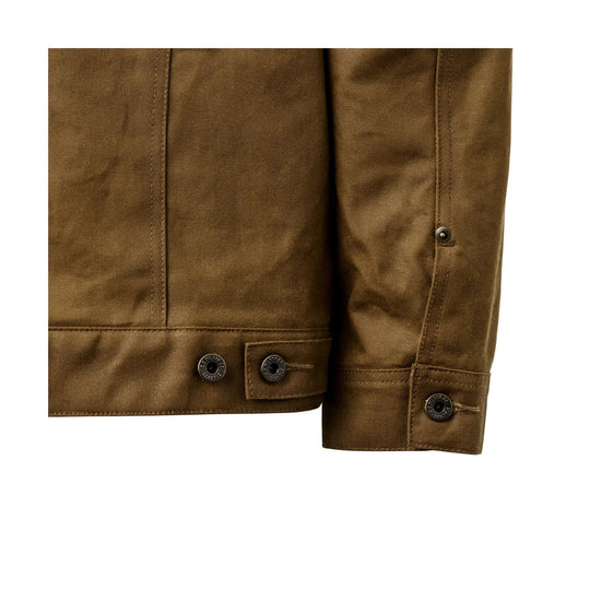 Close-up of a brown canvas jacket hem and cuff with metal snaps