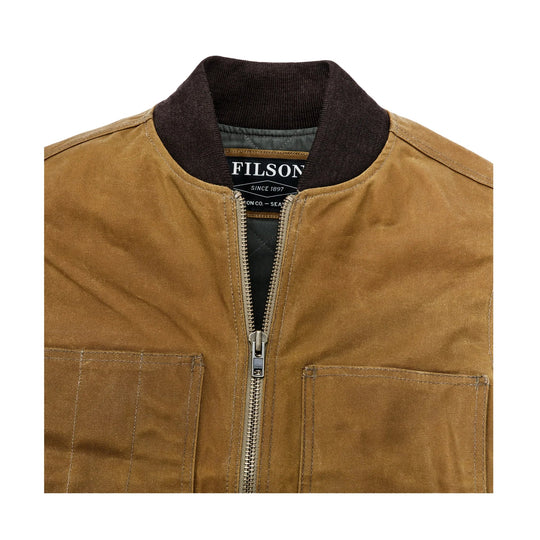 Tan canvas work vest with brown ribbed collar, front zipper, and patch pockets