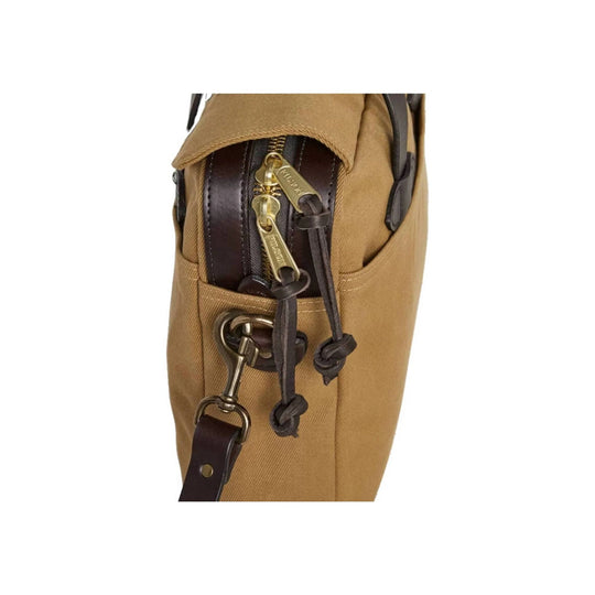 Tan canvas briefcase side with leather trim, brass zipper pulls, and strap hardware