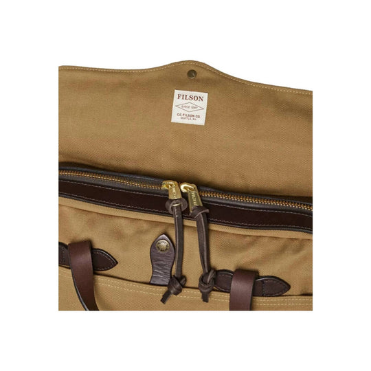 Tan canvas briefcase with leather handles, front buckle straps, and a zipper closure