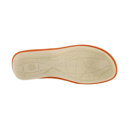 Beige shoe outsole with orange trim and textured tread, shown from below
