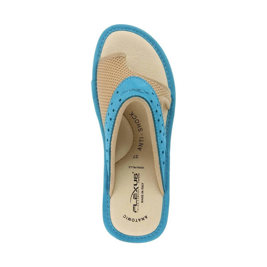 Turquoise and beige slip-on sandal with perforated upper and visible footbed branding