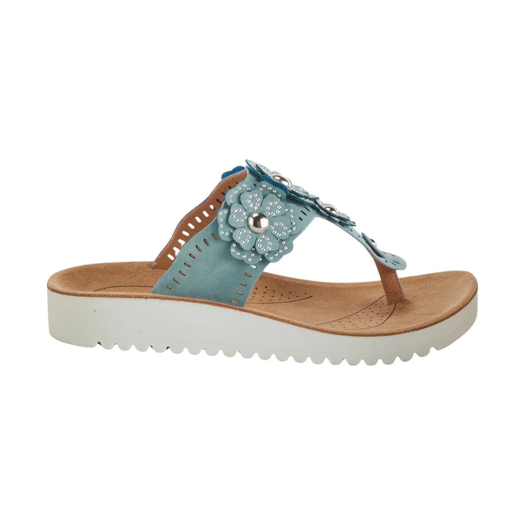 Blue and tan thong sandal with floral embellishment and white platform sole
