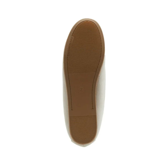 Off-white slipper shown from below with a brown textured sole and size 7 marking.