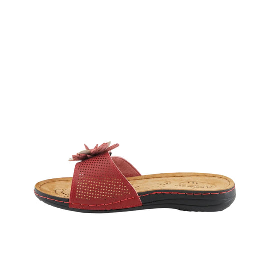 Red perforated slide sandal with floral toe detail and black wedge sole