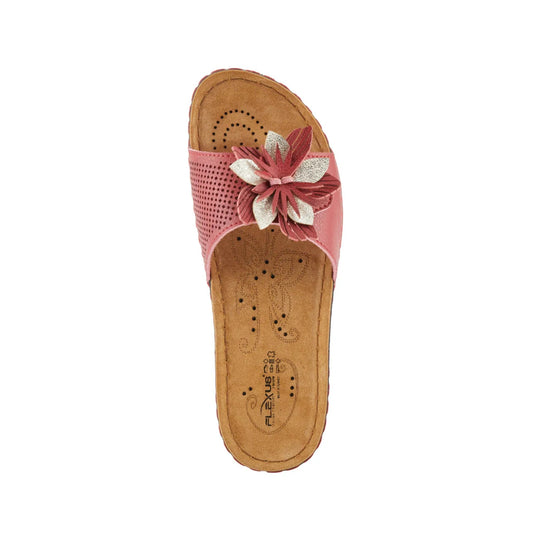 Pink slip-on sandal with perforated strap and floral applique