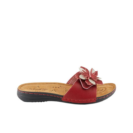 Red slip-on sandal with floral embellishment and cushioned cork-look footbed, side view
