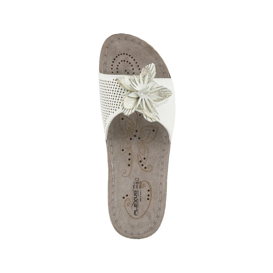 White slip-on sandal with perforated upper and large flower embellishment