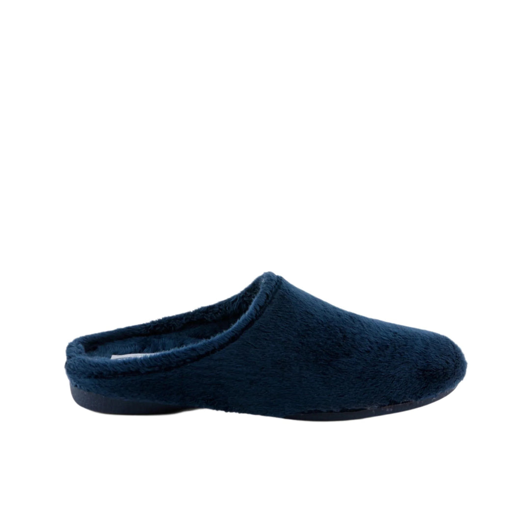 Navy fuzzy backless slipper in side view with a closed toe and black sole