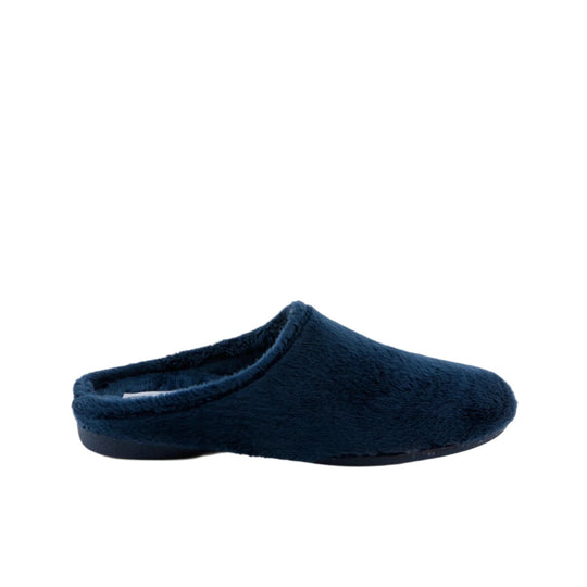 Navy fuzzy backless slipper in side view with a closed toe and black sole
