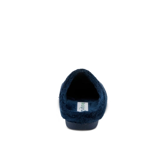 Navy fuzzy backless slipper with a low heel and visible insole tag