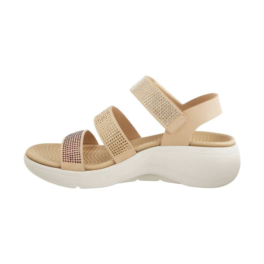 Beige platform sandal with rhinestone-covered straps and a white wedge sole, shown in side view