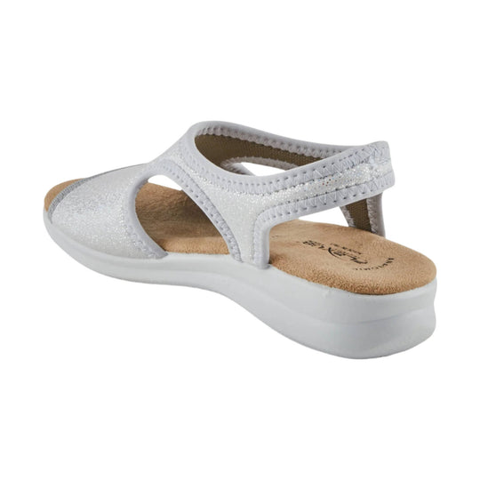 White strappy wedge sandal with cutout sides and tan cushioned footbed