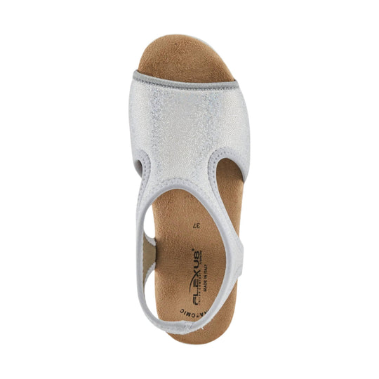 White closed-toe slingback sandal with cutouts and a tan footbed