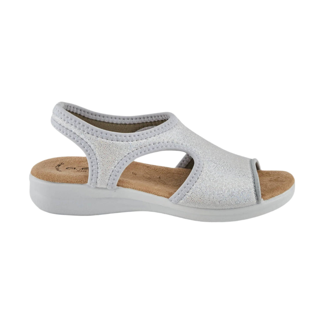 Silver wedge sandal with open toe, cutout sides, and a cork footbed