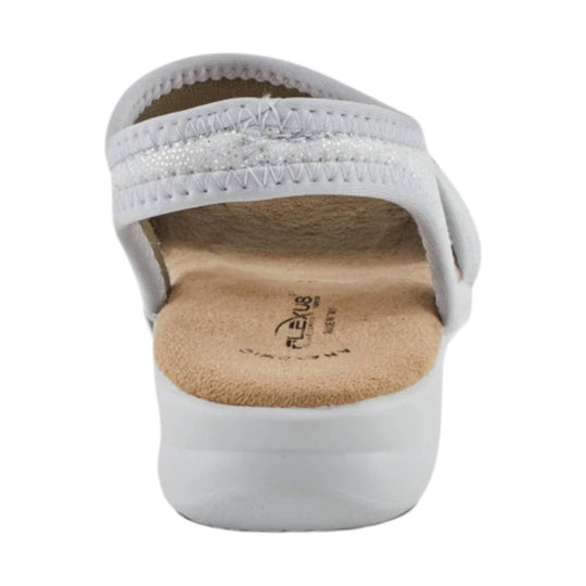 White cushioned sandal viewed from the back, with a tan contoured footbed and stitched upper straps