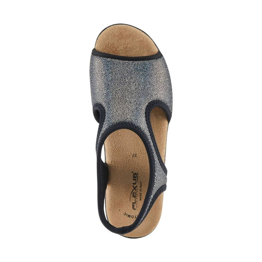 Black-and-white speckled closed-toe sandal with tan footbed and slingback heel strap