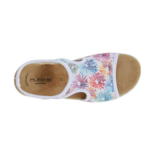 White floral slip-on sandal with tan footbed and cutout sides, shown from above