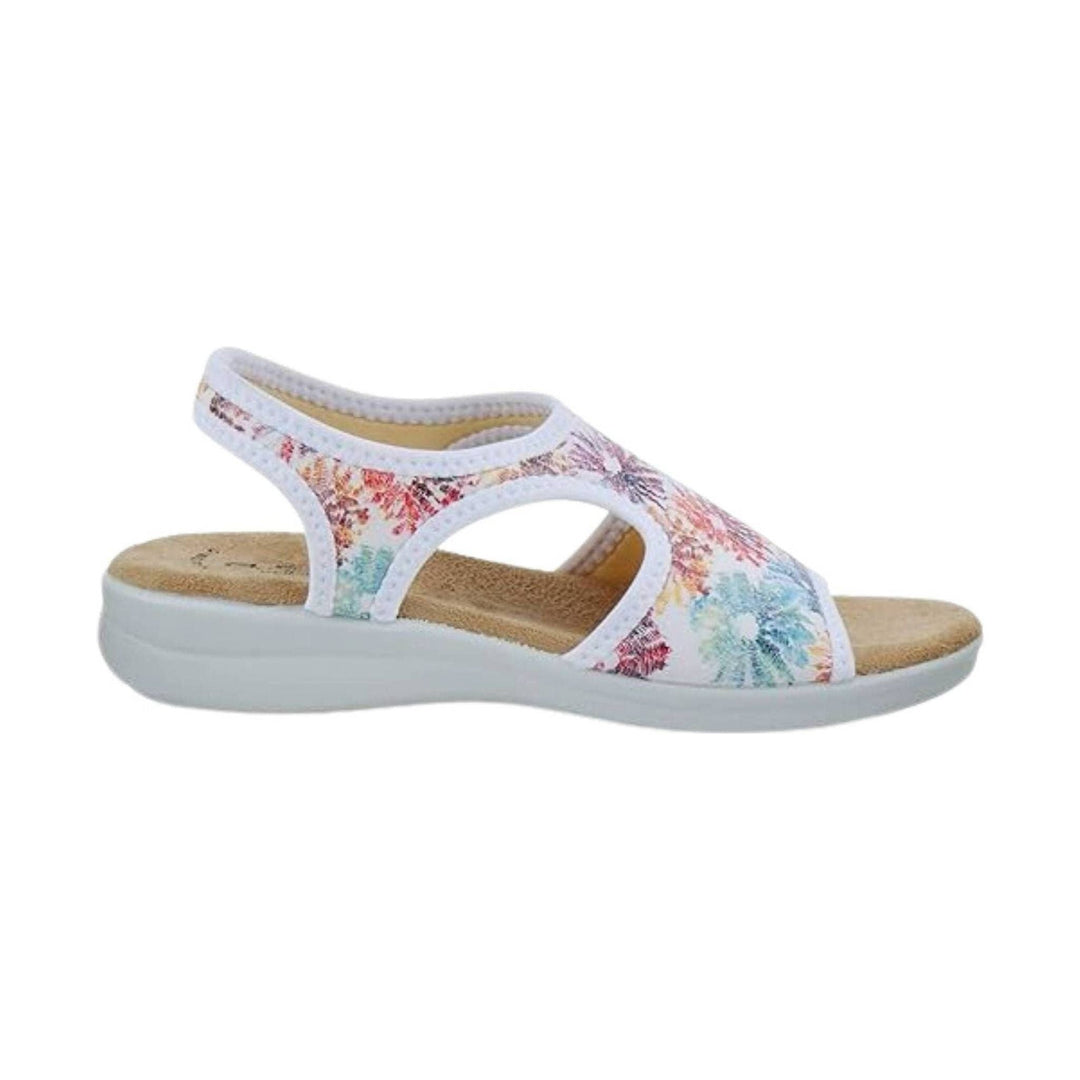White slingback sandal with pastel floral print, open side cutouts, and a cushioned white sole
