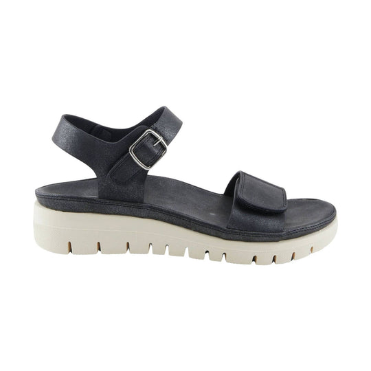 Black platform sandal with wide toe strap, ankle strap, and cream ridged sole