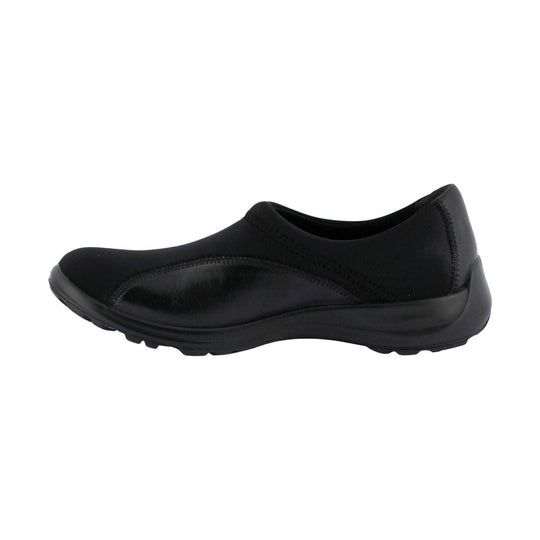 Black slip-on shoe with a rounded toe, curved sole, and low wedge heel