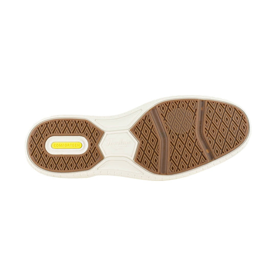 Shoe outsole with brown traction pods, white midsole, and COMFORTECH insert