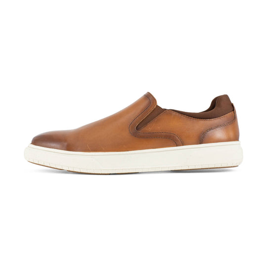 Brown slip-on work shoe with elastic side panels and a white sole