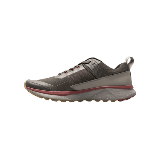 Brown and gray low-top hiking shoe with red accents and a pull tab