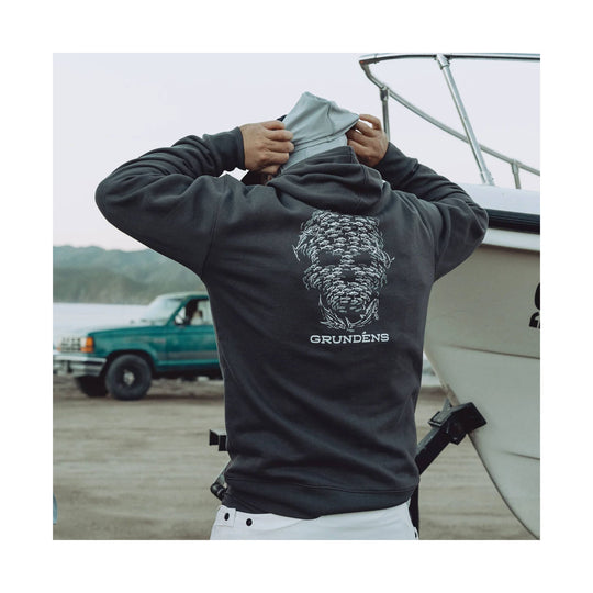 Charcoal hoodie shown from the back with a fish school graphic and GRUNDENS text