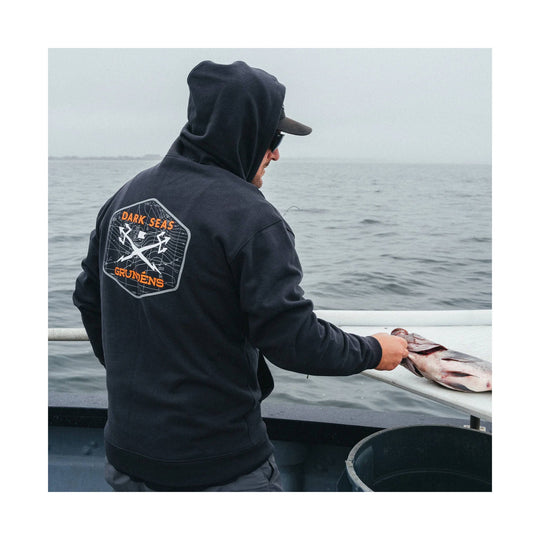 Black hooded sweatshirt with orange graphic text on the back