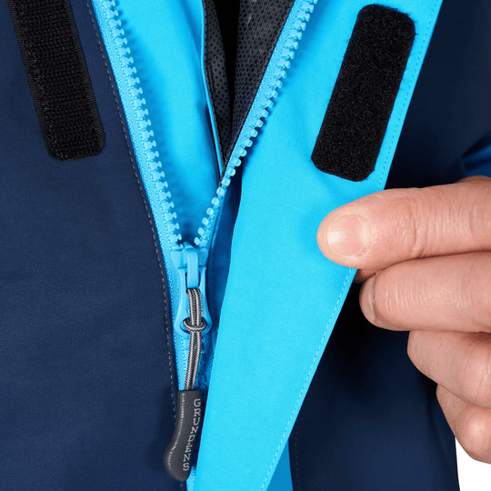 Blue waterproof jacket front with zipper, Velcro flap, and black trim