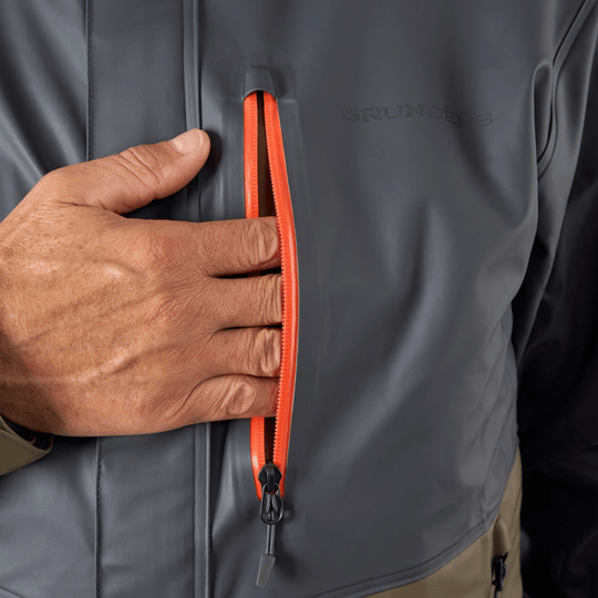 Gray waterproof jacket with orange front pocket zipper and chest logo