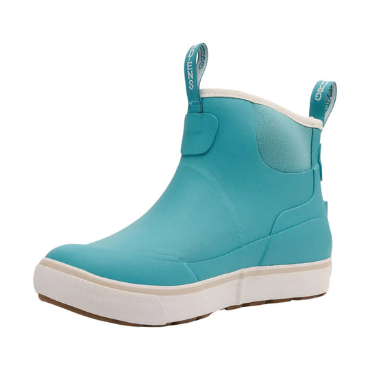 Turquoise ankle boot with pull tabs, white midsole, and tan outsole