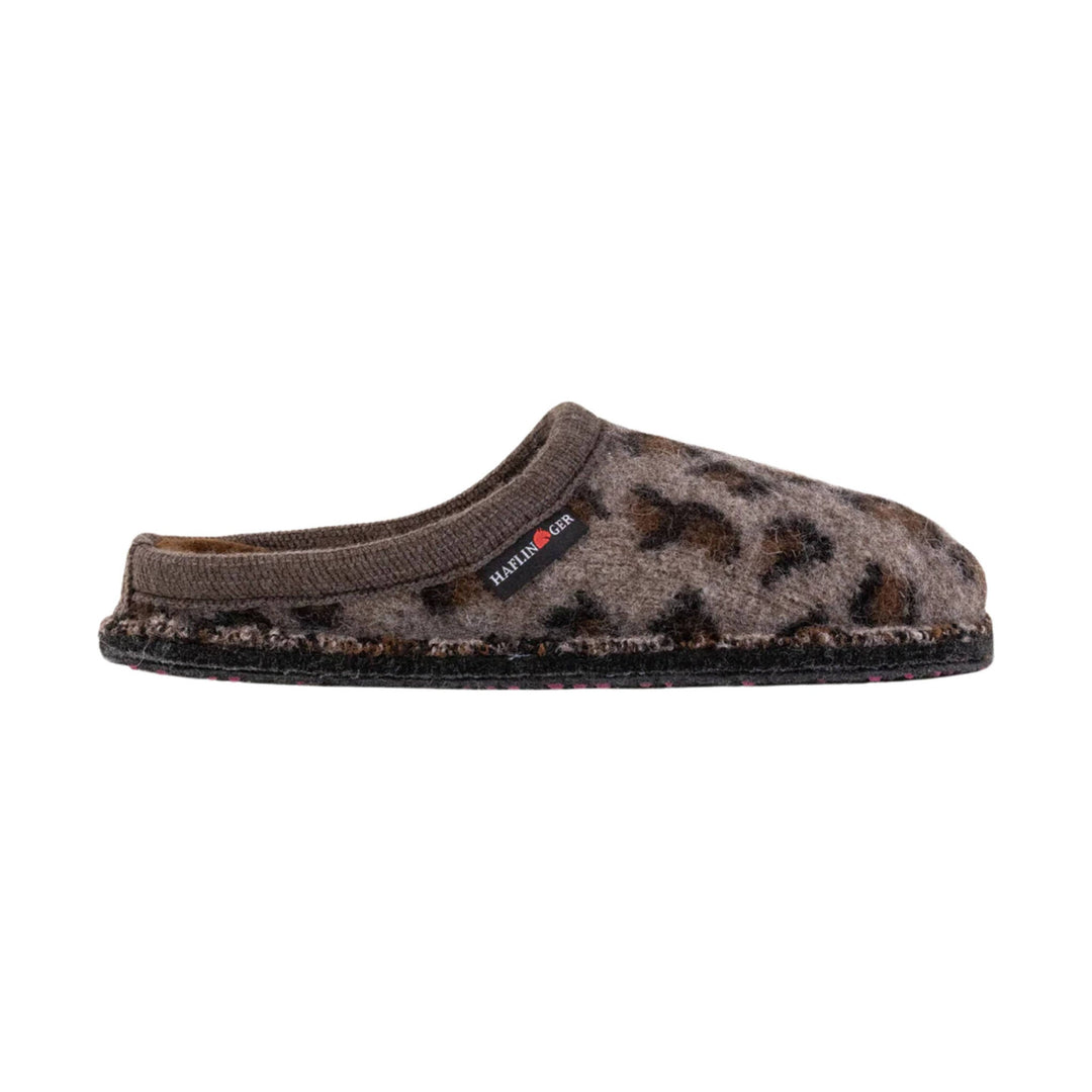 Brown fuzzy slip-on slipper with a side brand tag