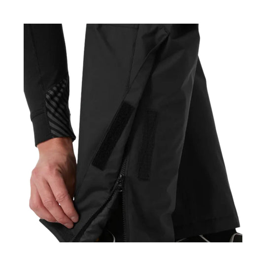 Black work pants with side zippers and reinforced leg panels