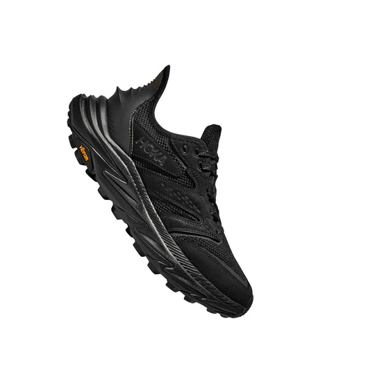 Black low-top hiking shoe with rugged tread, side overlays, and orange heel branding