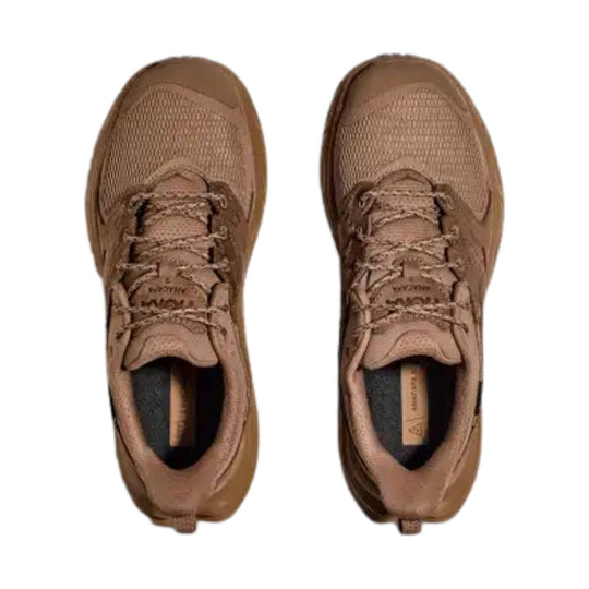 Pair of brown low-top hiking shoes with mesh uppers, bungee laces, and heel pull tabs