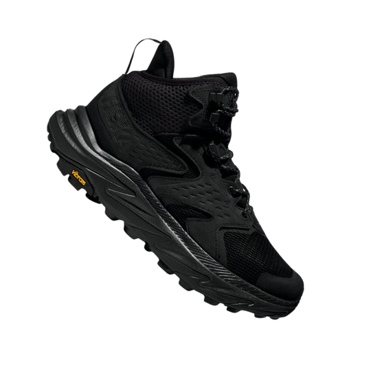 Black mid-top hiking boot with mesh panels, bungee laces, and a Vibram outsole