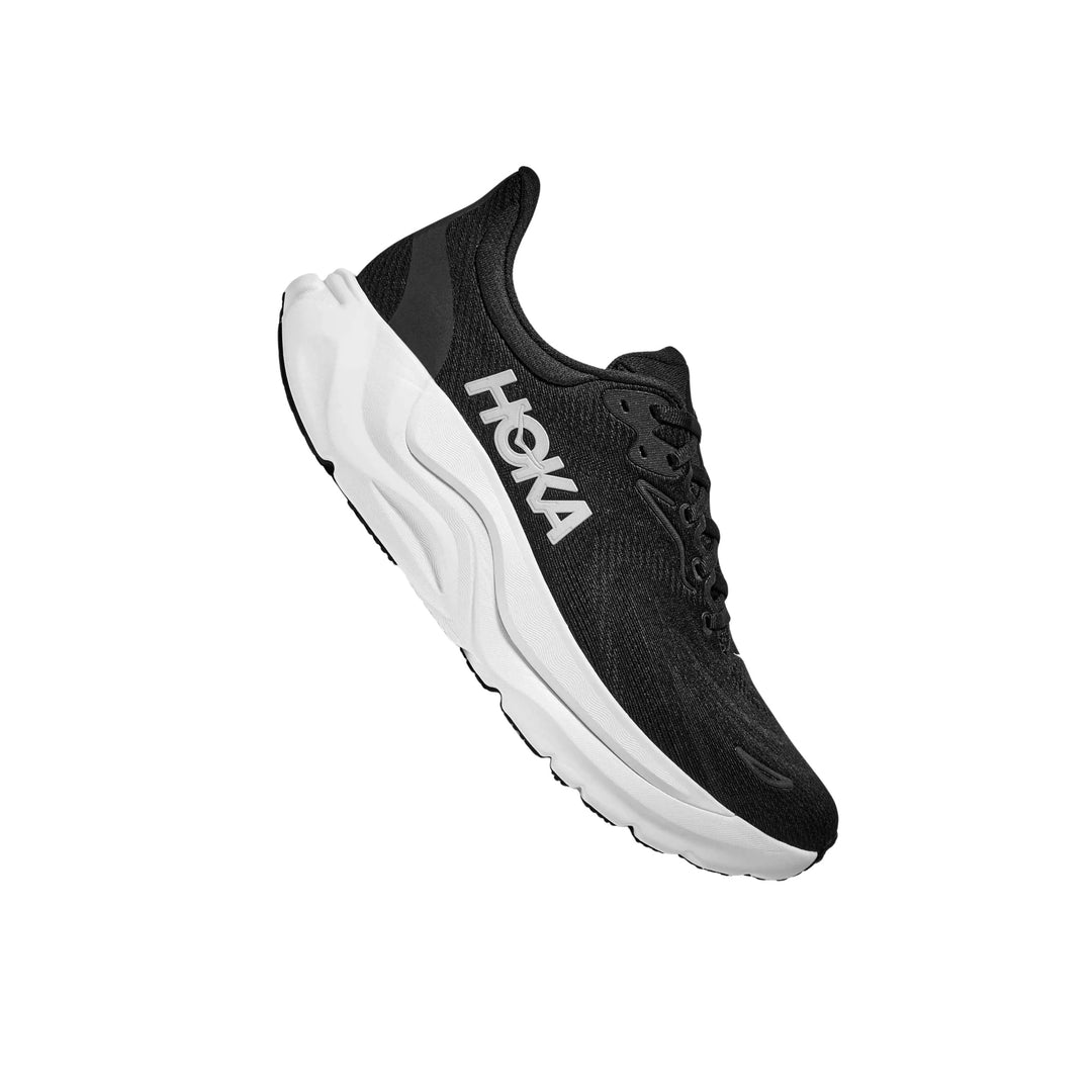 Black running shoe with a thick white cushioned sole and visible side logo, shown in side view