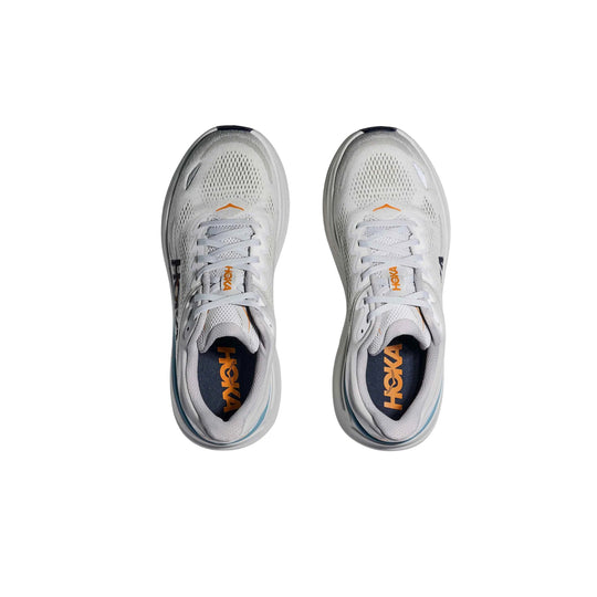 Pair of white and light gray running shoes with orange HOKA branding, shown from above