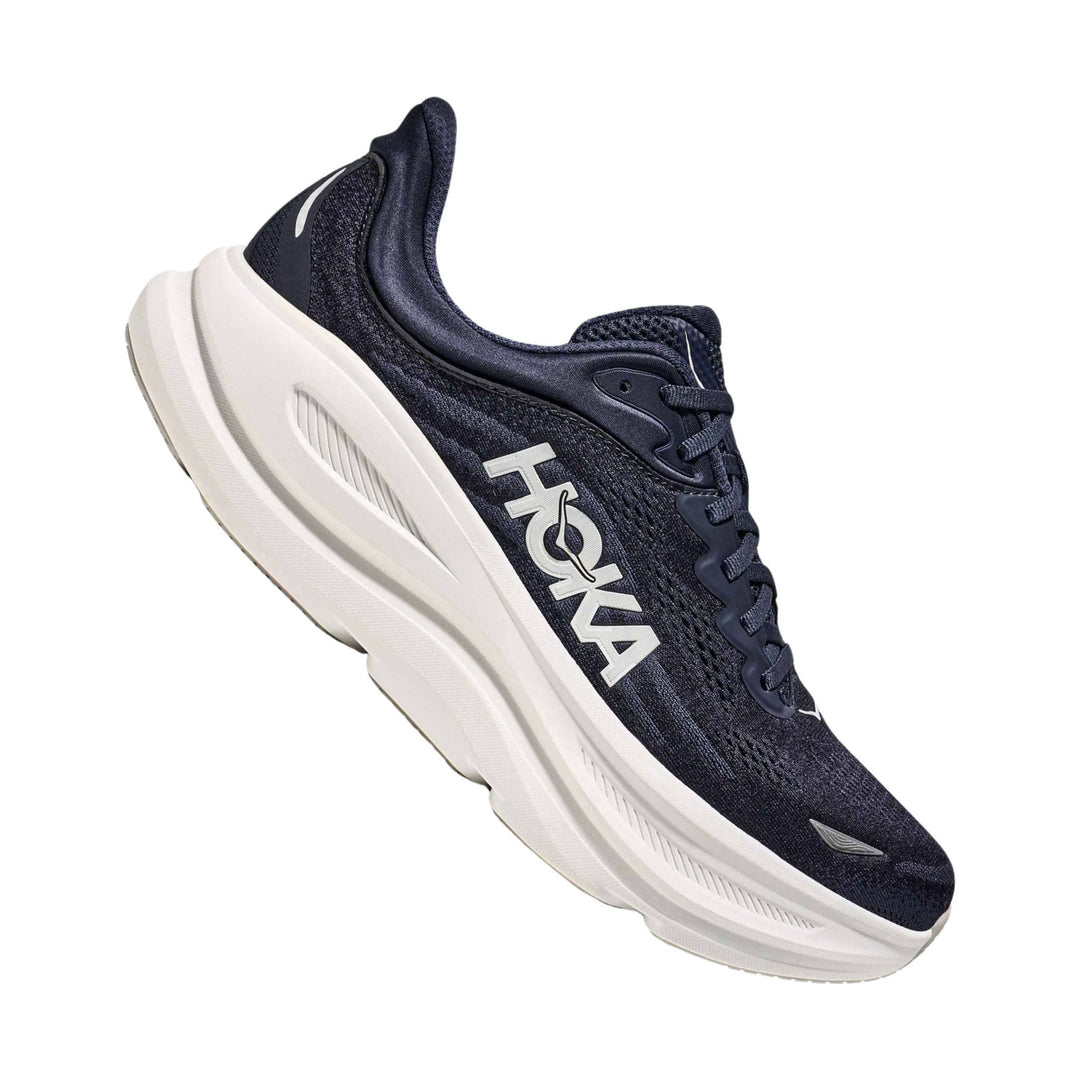 Navy running shoe with white chunky sole and large side logo