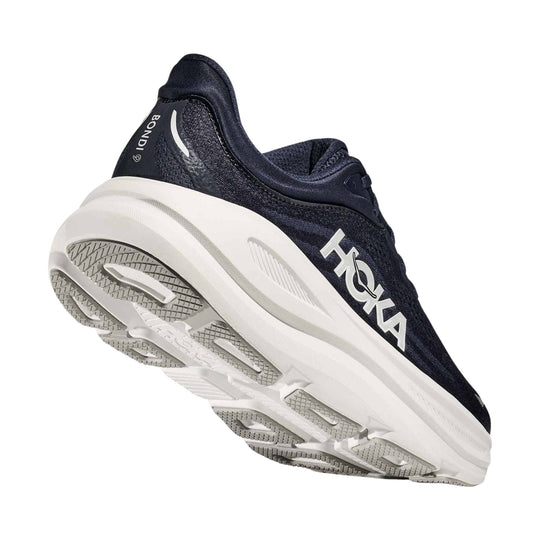 Black and white running shoe with thick cushioned sole and HOKA branding