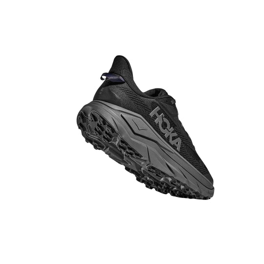 Black trail running shoe with gray midsole and treaded outsole, shown in side view