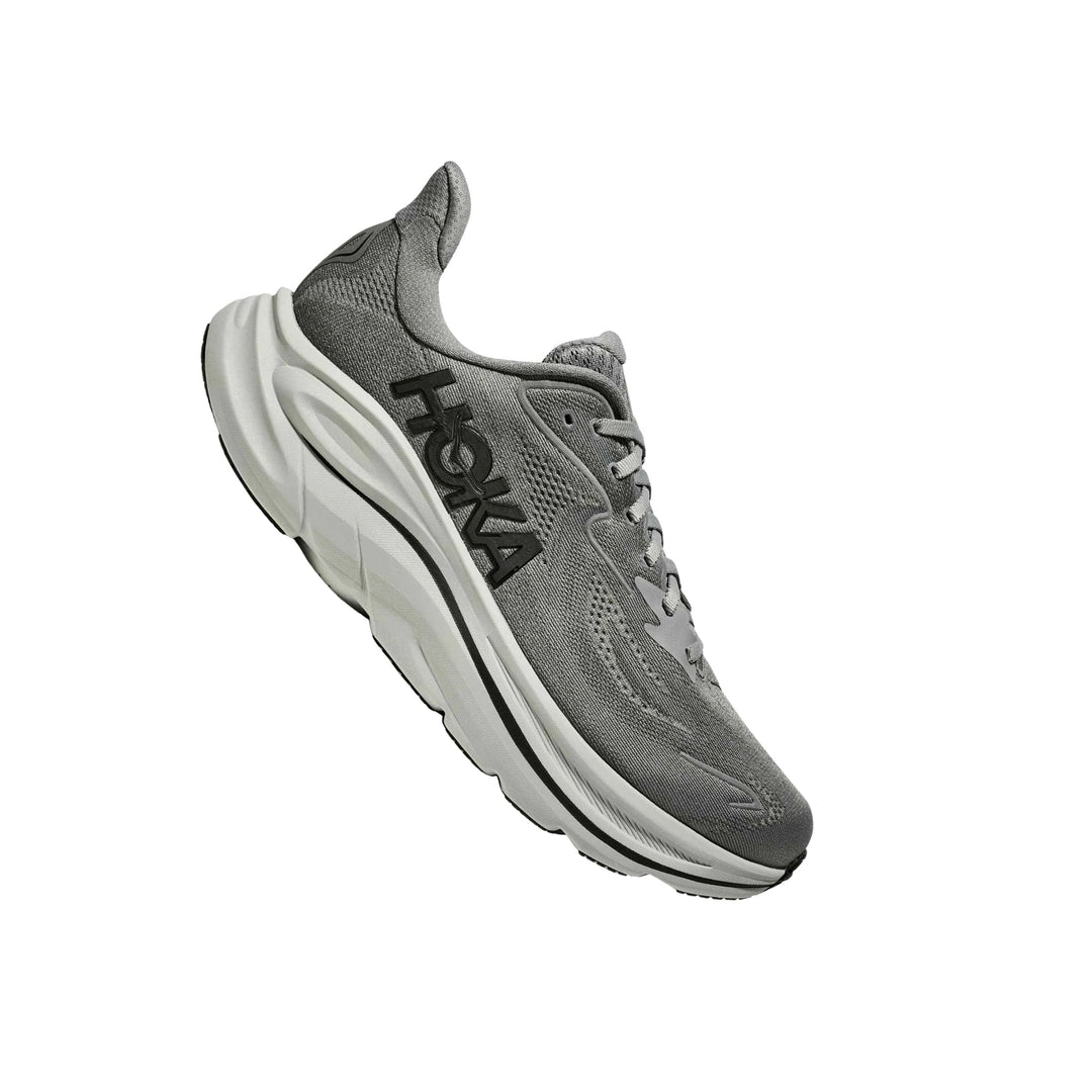 Gray running shoe with white cushioned sole and black side logo, shown in side view on white background.