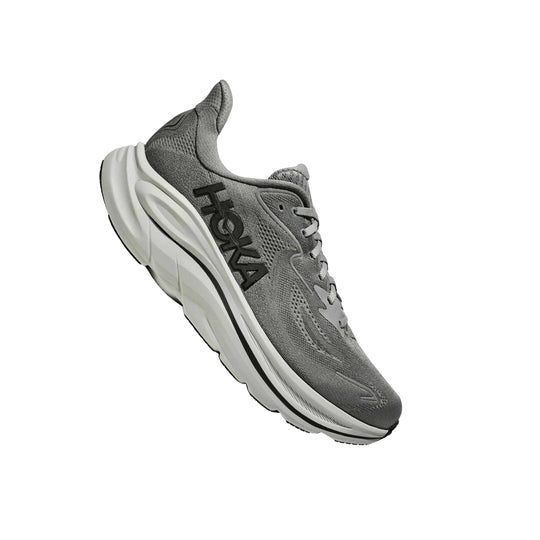 Gray running shoe with white cushioned sole and black side logo, shown in side view on white background.