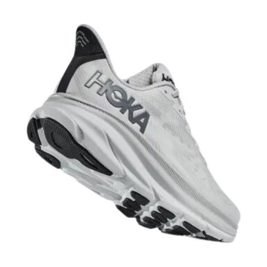 White running shoe with black heel accents and a thick cushioned sole, shown in side view