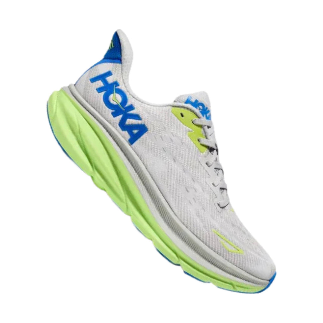 White running shoe with neon green sole and blue HOKA branding, side view