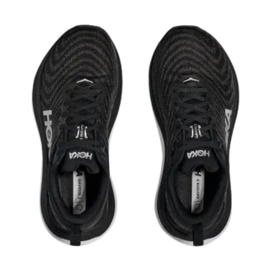 Black athletic running shoes with knit uppers, lace closure, and pull tabs, shown top view.
