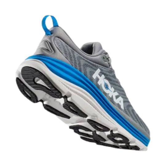 Gray athletic sneaker with blue side stripe, black outsole pods, and a heel pull tab